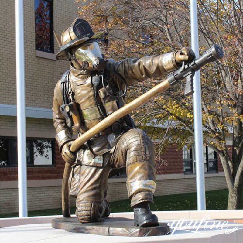 bronze fireman sculpture holding professional tools-YouFine Sculpture